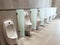 Perspective view of men urinal with automatic cleaning system