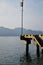 Perspective view of the piers on the waterfront with streetlamps and beautiful blue skies and clouds