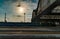 Perspective view of a platform in Lvov Central Railway Station with sunlight cast on trains parking by the platform