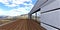 Perspective view of the stylish contemporary balcony with decked flooring and large panoramic glass door reflecting mountains
