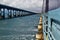 Perspective view to a road bridge from a indian railway train on the Pamban Bridge
