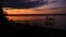 Perspective view of a wooden pier on the pond at sunset with perfectly specular reflection