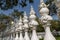 Perspective with white carved fence being like chess pieces