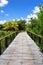 Perspective of wood bridge in deep tropical forest.