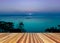 Perspective wooden empty with colorful seascape against purple s