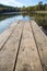 Perspective of wooden picnic table with blur landscape vertical background