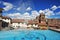 Peru Cuzco panoramic view of a water fountain with a tourist city,arquitecture