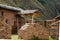 Peru, hillside rural farm, rustic, thatched roofs nestled in Andes mountains