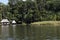 Peru Tingo Maria picturesque lagoon of miracles in the Amazon jungle with wooden houses thatched roofs on the palafitos river with