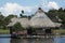 Peru Tingo Maria picturesque lagoon of miracles in the Amazon jungle with wooden houses thatched roofs on the palafitos river with