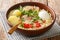 Peruvian Caldo de Gallina Chicken Soup closeup in the plate. horizontal