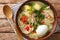 Peruvian Caldo de Gallina Chicken Soup closeup in the plate. horizontal top view