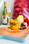 Peruvian dish Causa Limena with toasted mushrooms and glass of wine on blurred background