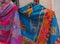 Peruvian Female colorful dress poncho with shape llama in market Machu Picchu one of the New Seven Wonder of The World, Cusco