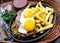 Peruvian Latin American food. Lomo a lo pobre. Beef whit fried potatoes french fry and eggs