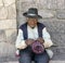 Peruvian native man knitting a hat