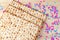 Pesach celebration concept. Matzah and confetti happy colorful background for Jewish Passover holiday.