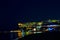 Peschici, Gargano, Apulia, Italy: Peschici by night, colorful lights with reflection on sea harbour