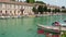 Peschiera del Garda, Italy. The beautiful historical city center. Promenade and entertainment along the water canal. Garda Lake