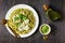 Pesto spaghetti with green peas and burrata cheese