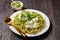 Pesto spaghetti with green peas and burrata cheese