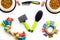 Pet accessories for care and training. Brushes, toys and food on white background top view