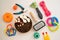 Pet accessories. Toys, equipment for grooming, bowl with feed, on white background top view. flat lay, copy space