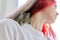 Pet Chilean squirrel degu sitting on the shoulder of its young owner