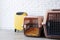 pet corner plastic pet carriers or pet cages with yellow travel case on the floor at home