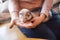 Pet ferret eating from the hand of its owner