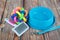 Pet leashes with rubber toy and bowl on wooden background