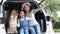 Pet Lover. An Asian family with a mother, daughter and son watching the seaside views on a van. Happy asian family with shiba inu