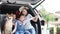 Pet Lover. An Asian family with a mother, daughter and son watching the seaside views on a van. Happy asian family with shiba inu