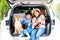 Pet lover. Happy asian children and Mother with shiba inu sitting and Sing Song in car