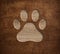 Pet paw print dog cat symbol engraved in wooden board