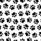 Pet prints. Paw seamless pattern. Cute background for pets, dog or cat. Foot puppy. Black silhouette shape paw. Footprint pet. Ani