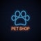 Pet shop neon . Neon pet paw on wall background