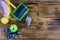 Pet slicker brushe, claw clipper and toys on a wooden background. Top view