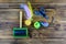 Pet slicker brushe, claw clipper and toys on a wooden background. Top view