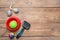 Pet toys, bowl and brush on wooden table, flat lay. Space for text