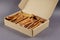 Pet Treats. Cardboard box full of chew sticks. Natural chewy tre