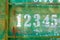 Petanque scoreboard number on green rusty metal texture plate