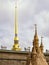 Peter and Paul fortress, the spire of Peter and Paul cathedral and the fragment of a sandy sculpture.