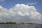 Peter-Pavel`s Fortress near Neva river, huge cloud hanging over the bank