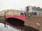 Petersburg, Russia, December 2019. Red bridge over the Moika River and public transport.