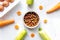 Petfood set with vegetables and eggs on kitchen table background top view