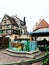 Petit Venice, fountain, square and colorful traditional french houses Colmar, France.