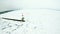 Petoskey Harbor Breakwater in spring with frozen lake