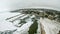 Petoskey Harbor Breakwater in spring with frozen lake