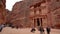 Petra, Jordan - January 20, 2020: Al-Khazneh or The Treasury - main attraction at lost city of Petra, temple carved in stone wall